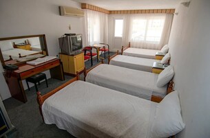 Family Room | Minibar, WiFi (free), bed sheets