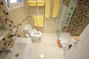 Shower, hair dryer, towels, soap