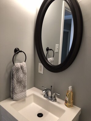 Bathtub, hair dryer, towels, soap