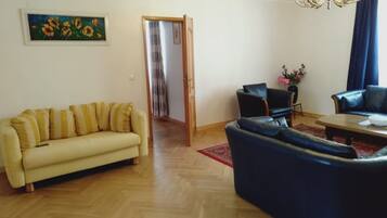 Apartment, 1 Bedroom | Living area | 32-inch TV with digital channels