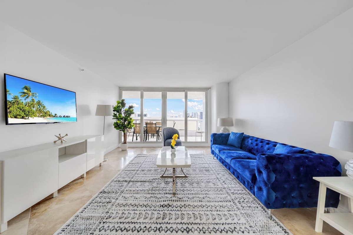 Deluxe Apartment, 3 Bedrooms, Bay View | Living area | 55-inch TV with digital channels, Netflix, streaming services