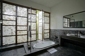 Villa Sesapi Downstairs with private pool | Bathroom | Hair dryer, slippers, towels, soap - Tegal Sari Accomodation (Ubud)