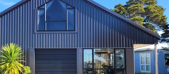 Cedar Heights Chalet with Elevated Ocean Views in a Native bush setting.