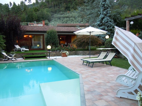 House with large veranda, garden and swimming pool