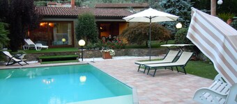 House with large veranda, garden and swimming pool