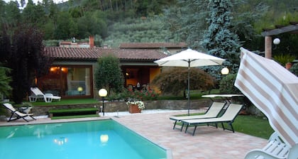 House with large veranda, garden and swimming pool