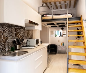 Fridge, microwave, stovetop, coffee/tea maker