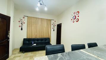 Apartment, 1 Bedroom | Living area | Flat-screen TV