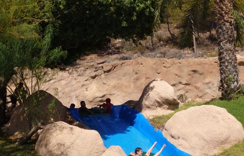 Fantastic ground front line apartment with garden and pool .