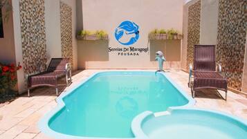 Outdoor pool, open 8:00 AM to 8:00 PM, pool loungers