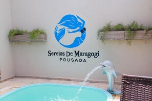 Outdoor pool, open 8:00 AM to 8:00 PM, pool loungers