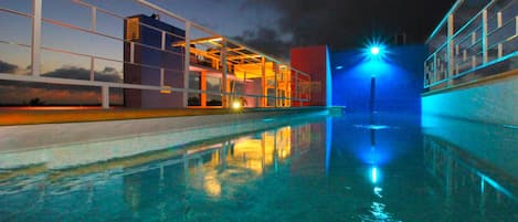 Outdoor pool, open 9:00 AM to 10:00 PM, pool loungers