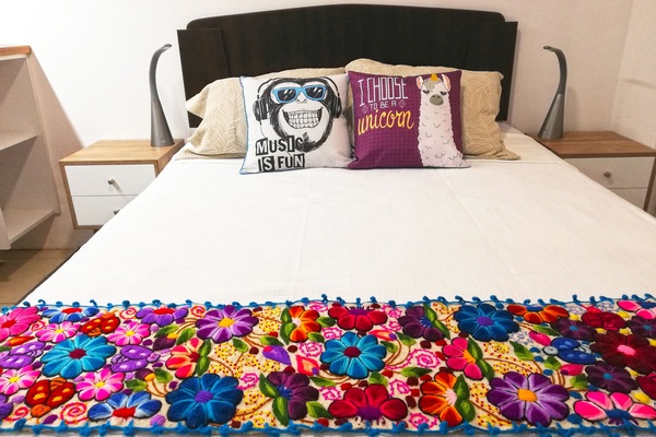 View of the bed with top quality mattress, LED lamps provide USB chargers