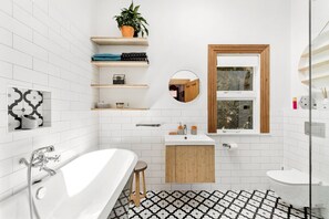 Bathtub, hair dryer, towels, soap