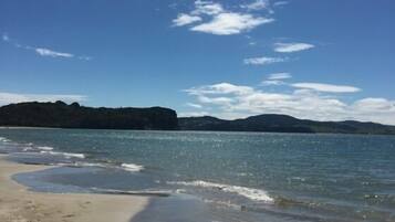 On the beach, sun-loungers