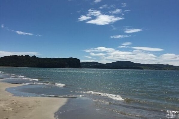 On the beach, sun-loungers