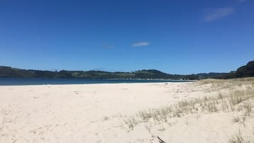 On the beach, sun-loungers