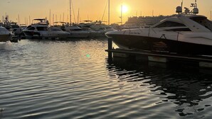 A marina with several boats docked at sunset. - Beautiful 3 bedroom townhouse located in Vila Sol in the heart of the Algarve  (Quarteira Vilamoura)