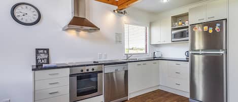 Fridge, microwave, dishwasher, cookware/dishes/utensils