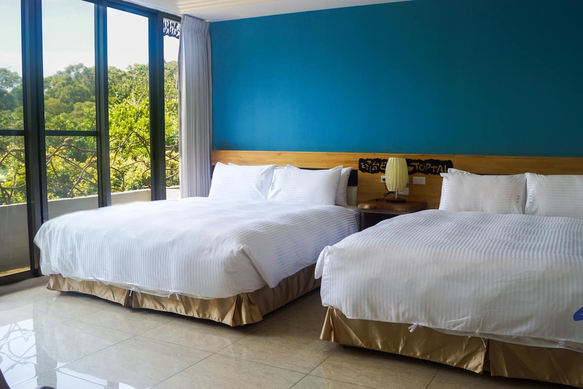 Family Quadruple Room | Down comforters, individually decorated, desk, blackout drapes