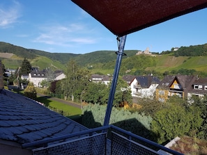 Enjoy breathtaking views of the lush valley from this balcony.