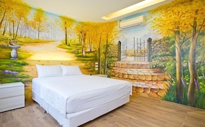 A bedroom with a mural of a forest path, a bed, a nightstand, and a dresser. - Sinyuange B&B (Xinyuan)