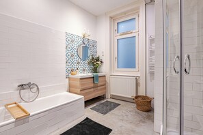 Bathtub, hair dryer, towels, soap