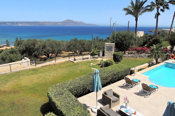 40 Amira lounging terrace, pool, garden, and sea view.