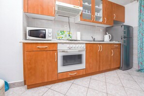 Apartment (A2) | Private kitchen | Fridge, microwave, oven, stovetop - Apartments Olea (Rogoznica)