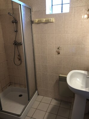 Shower, towels, soap, toilet paper