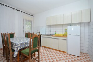 Private kitchen | Fridge, stovetop - Apartments Branko (Vodice)