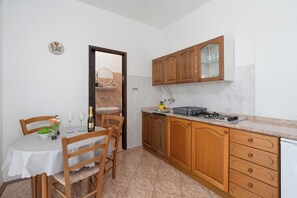 Apartment (A3) | Private kitchen | Fridge, stovetop