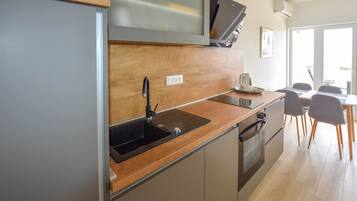Appartement (A2) | Cuisine privée | Réfrigérateur, plaque de cuisson, machine à expresso
