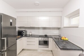 Private kitchen | Fridge, stovetop, espresso maker, cookware/dishes/utensils - Apartments Tina Sea View (Pag)