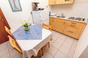 Apartment (A4) | Private kitchen | Fridge, cookware/dishes/utensils