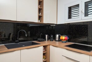 Apartment (A1) | Private kitchen | Fridge, microwave, oven, stovetop - Apartments Hrvatic (Rogoznica)