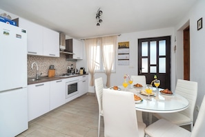 Apartment (A3) | Private kitchen | Fridge, microwave, oven, stovetop - Apartments Hrvatic (Rogoznica)