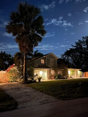 Stroll up to this charming home, featuring a spacious porch and a beautifully manicured lawn.