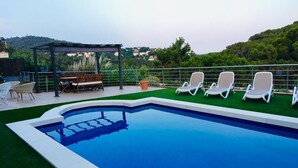 Outdoor pool, a heated pool - MODERN AND BEAUTIFUL VACATION HOME IN A QUIET LOCATION FOR 10 PEOPLE BEACH 2 KM. (Lloret de Mar)