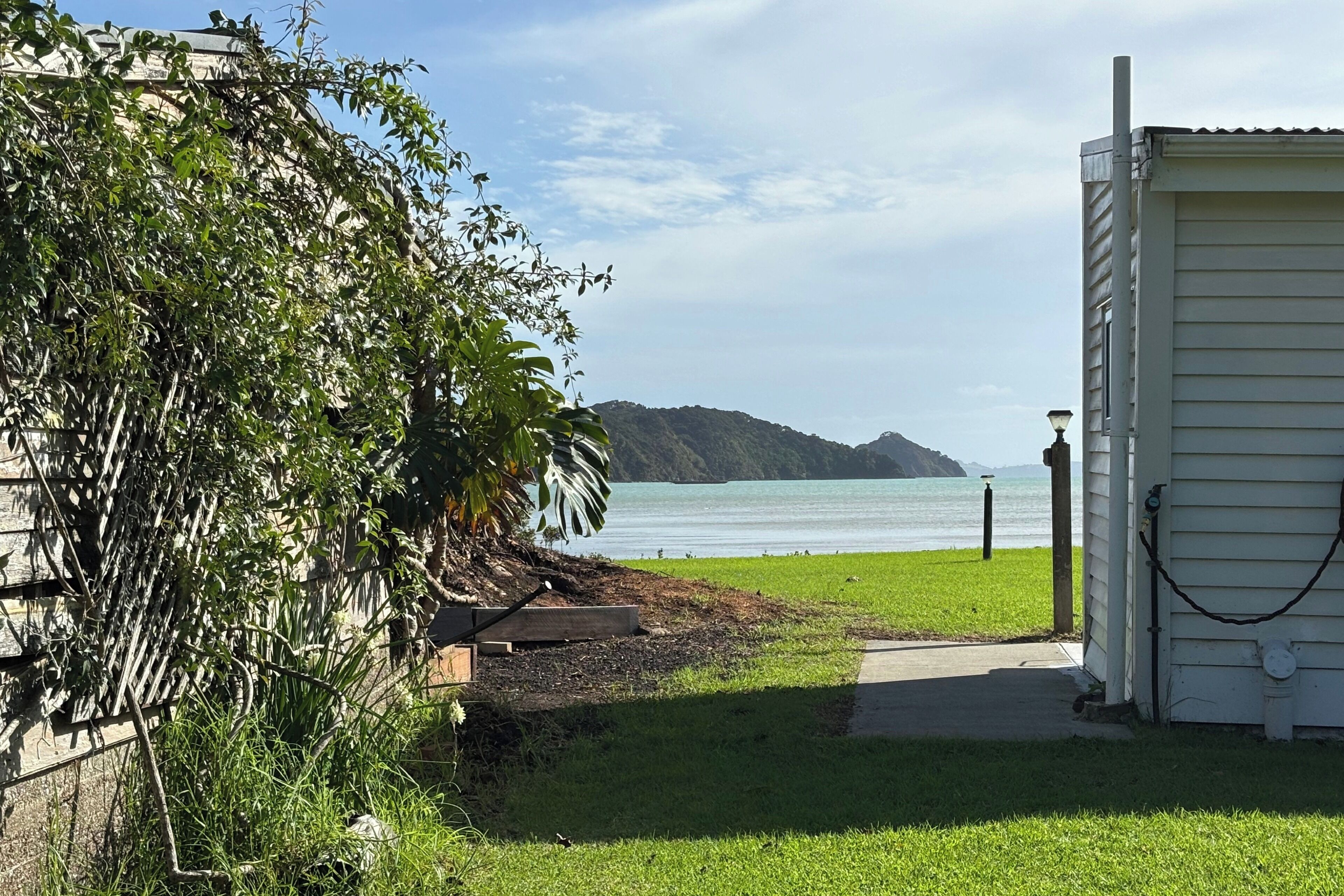 Peek sea view with easy flat foreshore access. White building is Homestead.