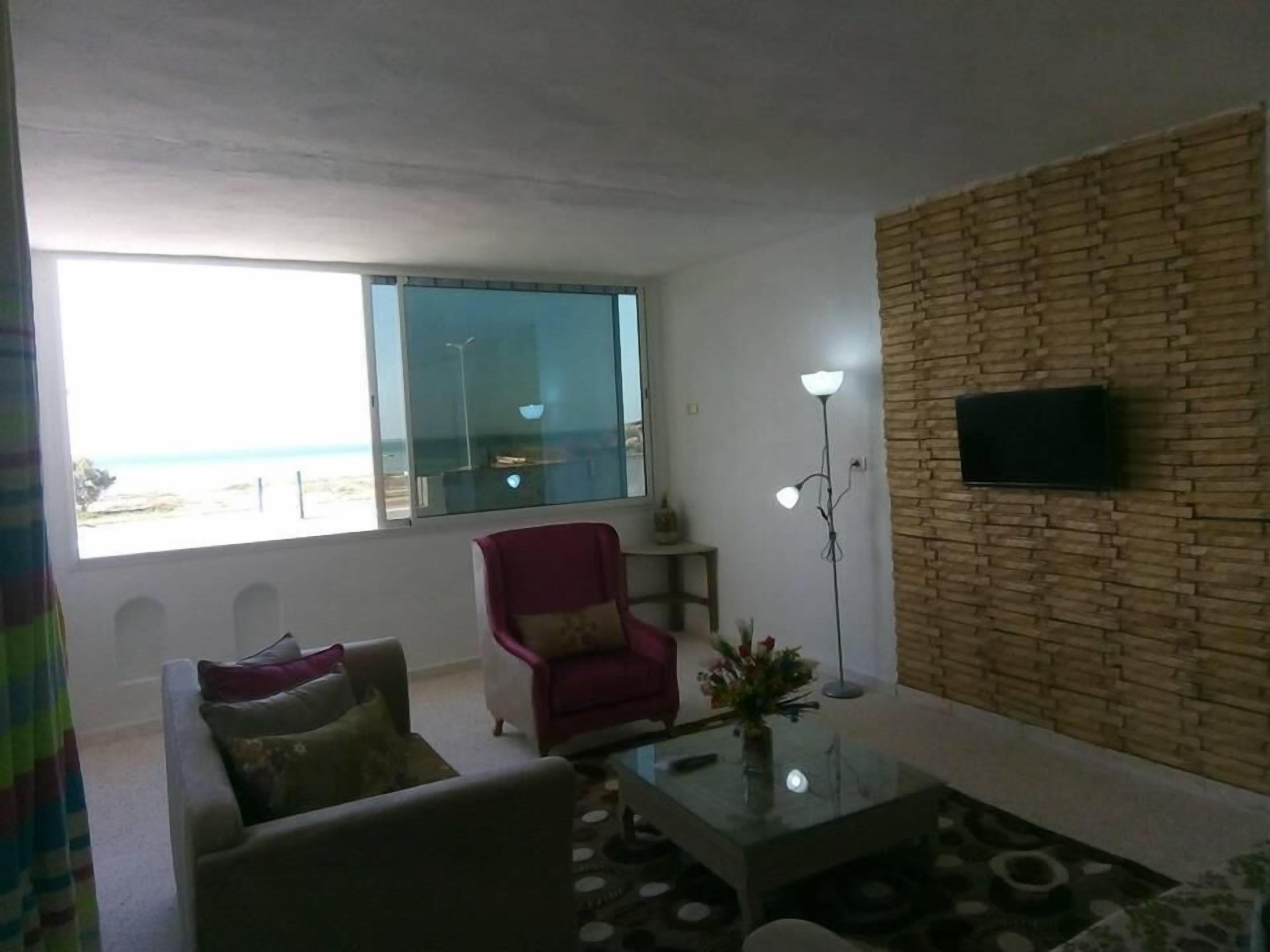 Deluxe Apartment | Living area | Plasma TV