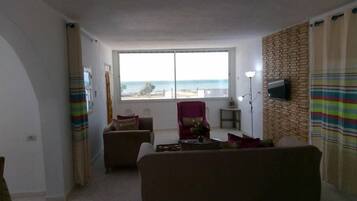 Deluxe Apartment | Living area | Plasma TV