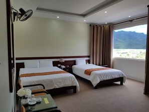 Habitación familiar | Ropa de cama de alta calidad y colchones con acolchado adicional