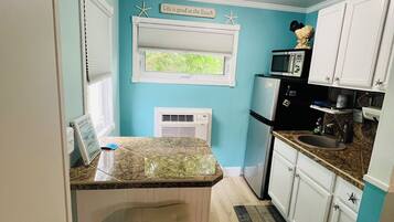 Fridge, microwave, coffee/tea maker, toaster