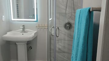 Shower, hair dryer, towels, soap