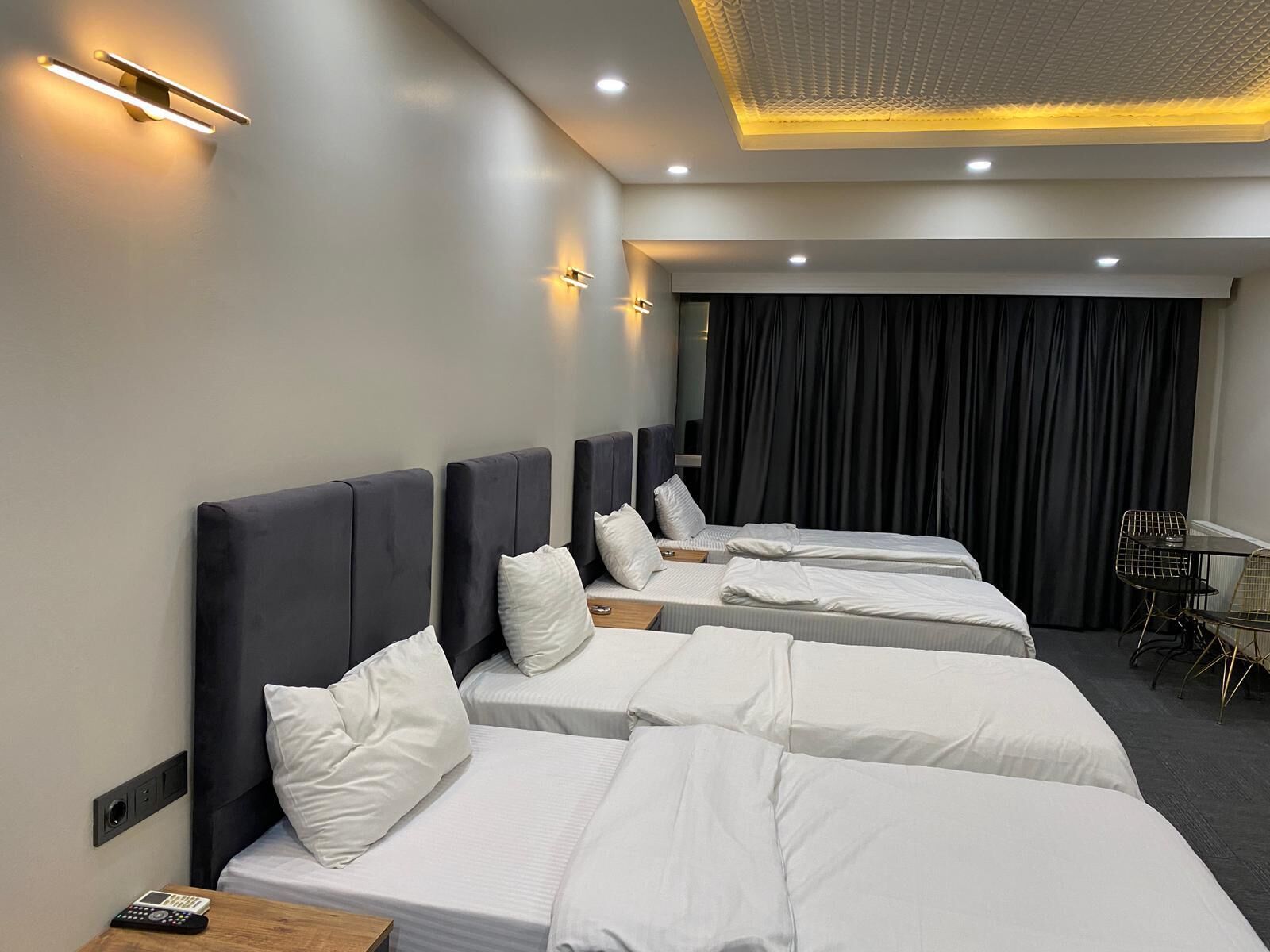 Triple Room | Minibar, in-room safe, iron/ironing board, free WiFi