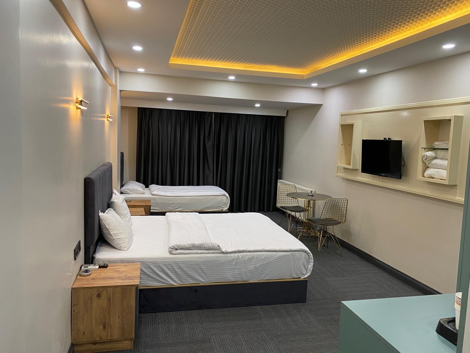 Family Room, Multiple Beds | Minibar, in-room safe, iron/ironing board, free WiFi