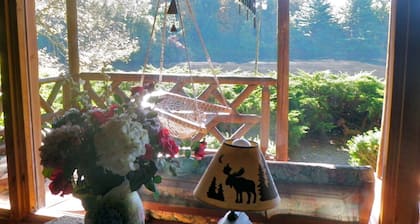 Secluded & Romantic Log Cabin with fireplace on Private lake & 85 acres
