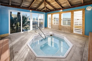 Relax by the pool with a clear view of the surrounding landscape through large windows.