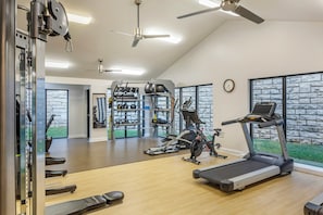 A gym with treadmills, weight machines, and free weights. - Laurel Crest (Pigeon Forge)